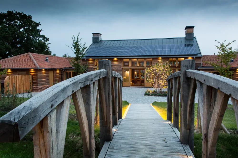 Wooden footbridge leading to entrance of Retreat East