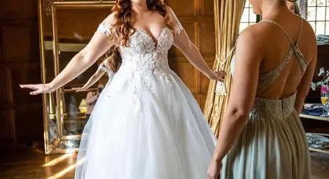 Bride in white dress smiling radiantly