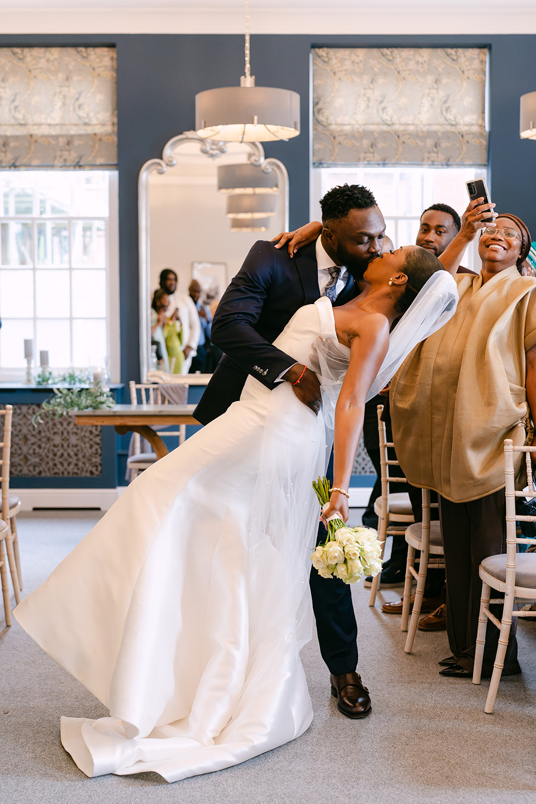 Bride and groom kissing with a swoon at the Bury St Edmunds Register Office
