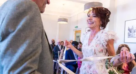 Bride smiling at groom at a tying the knot ceremony at the Bury St Edmunds register office