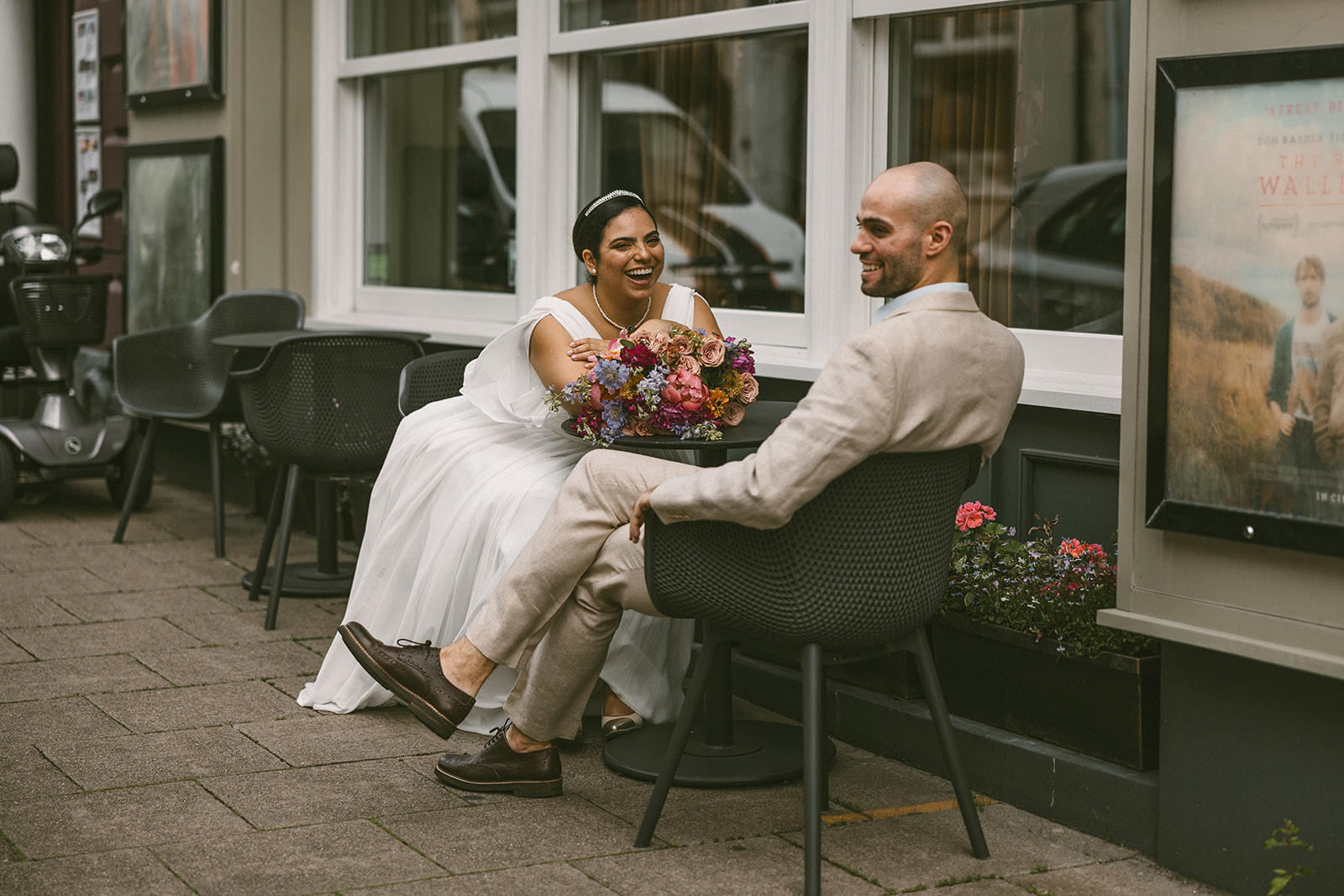 Couple sitting outside cinema