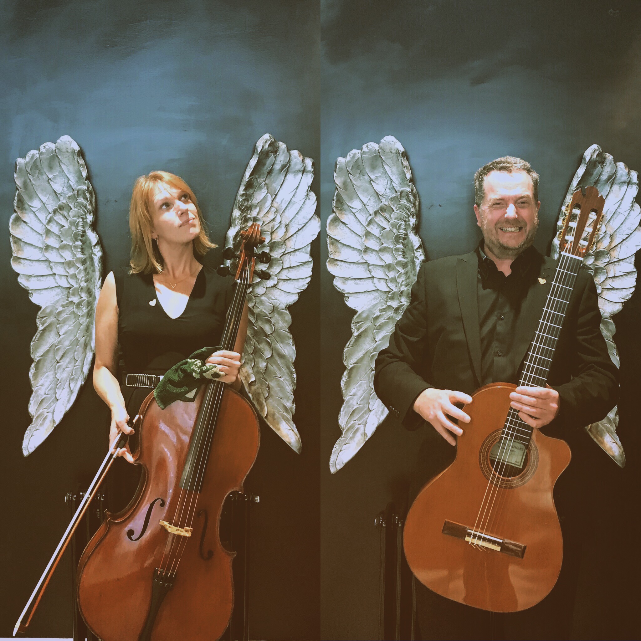 Duetto Arpeggione in front of black background with angel wings holding a cello and guitar