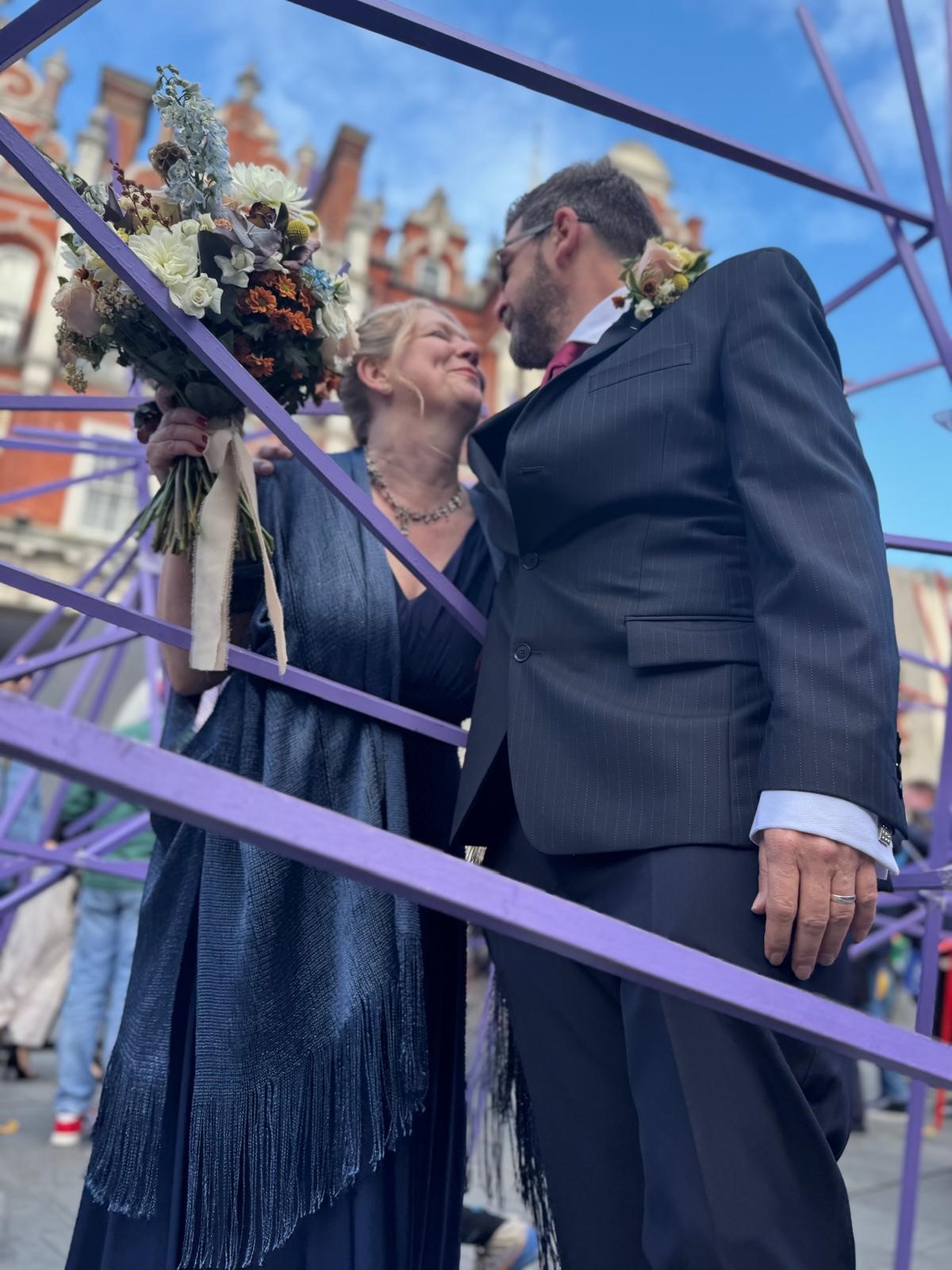 Bride and Groom beneath the Ipswich Town Hall during their Suffolk registry office wedding