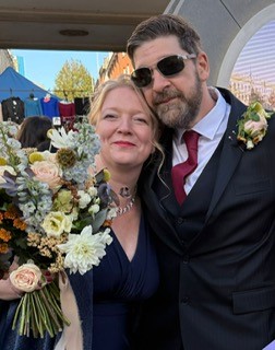 Couple with bouquet outside Ipswich Town Hall
