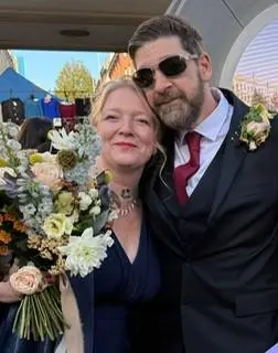Couple with bouquet outside Ipswich Town Hall