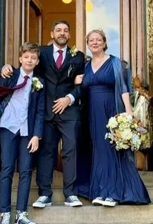 Bride and Groom with their teenage son outside Ipswich Town Hall