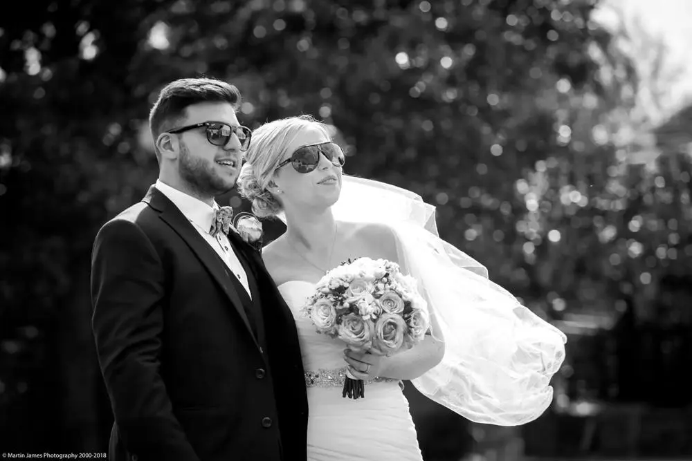 Couple with sunglasses, black and white photo
