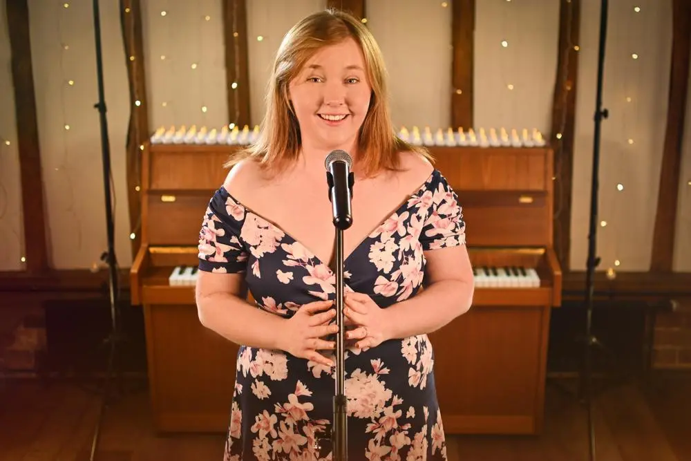 Naomi Collins Vocalist in front of a piano