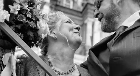 Couple black and white image smiling at each other