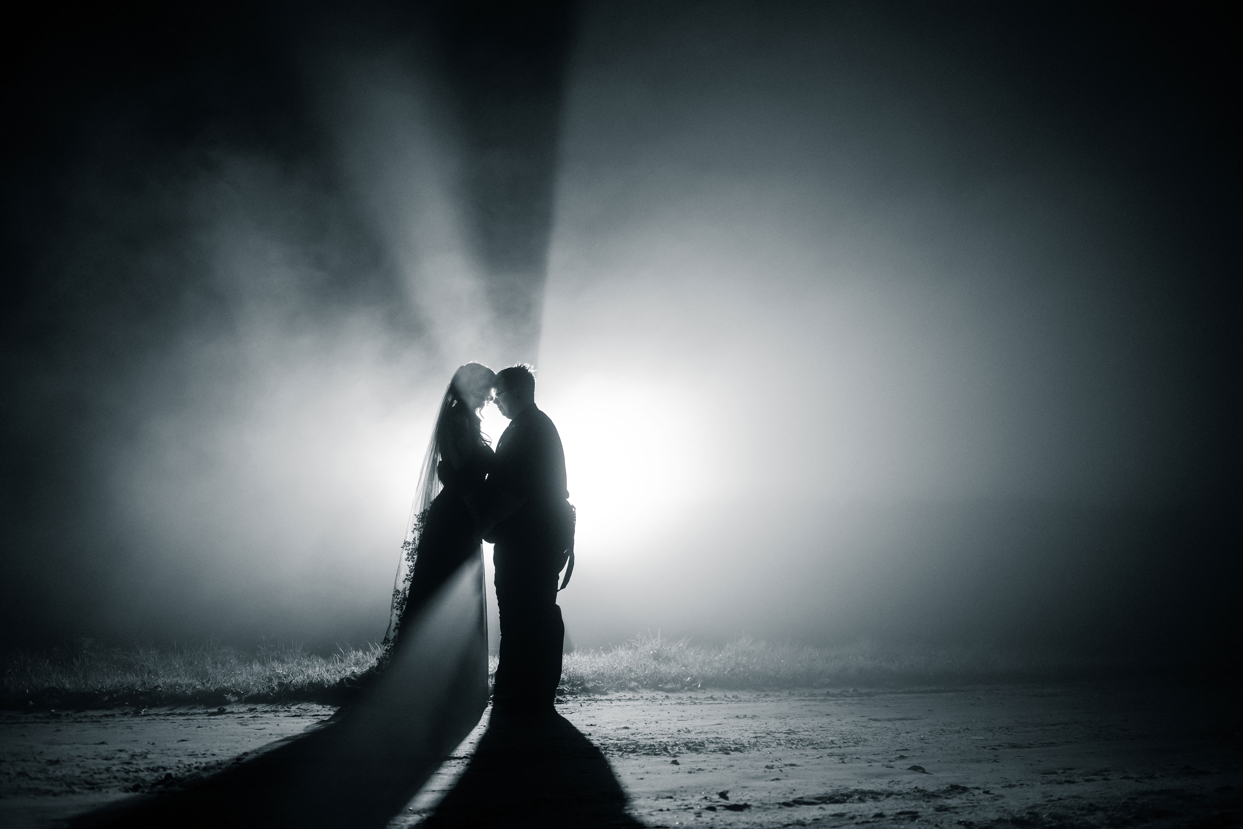 Black and white image of bride and groom dancing