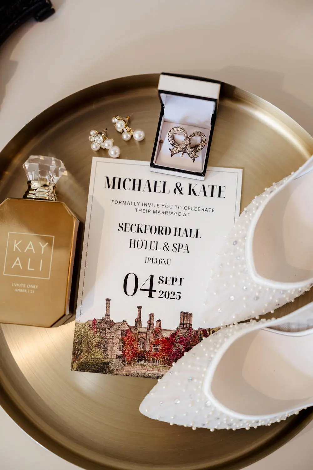 Wedding invitation for Michael & Kate with pearl heels and perfume