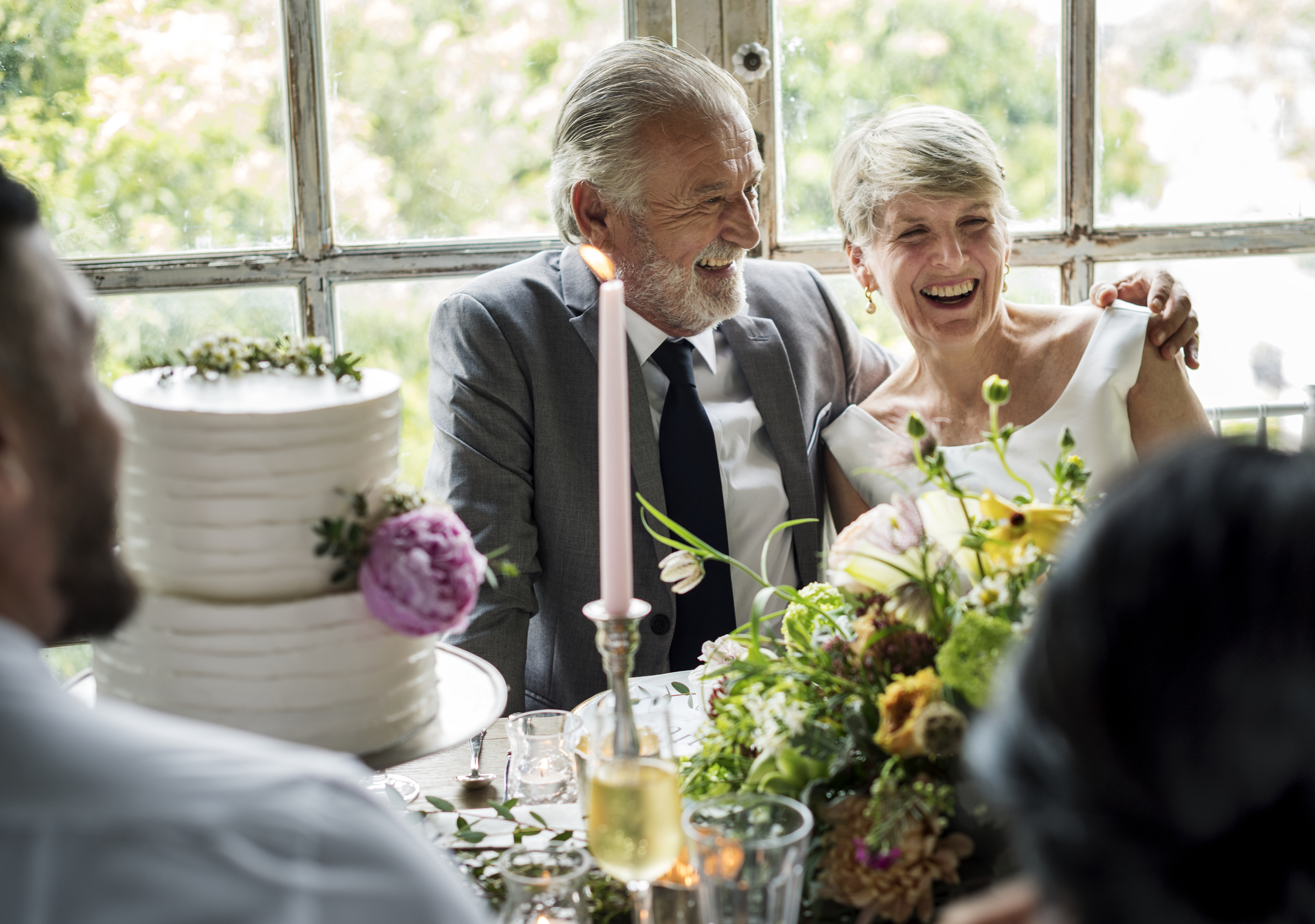 senior-couple-sitting-and-smiling
