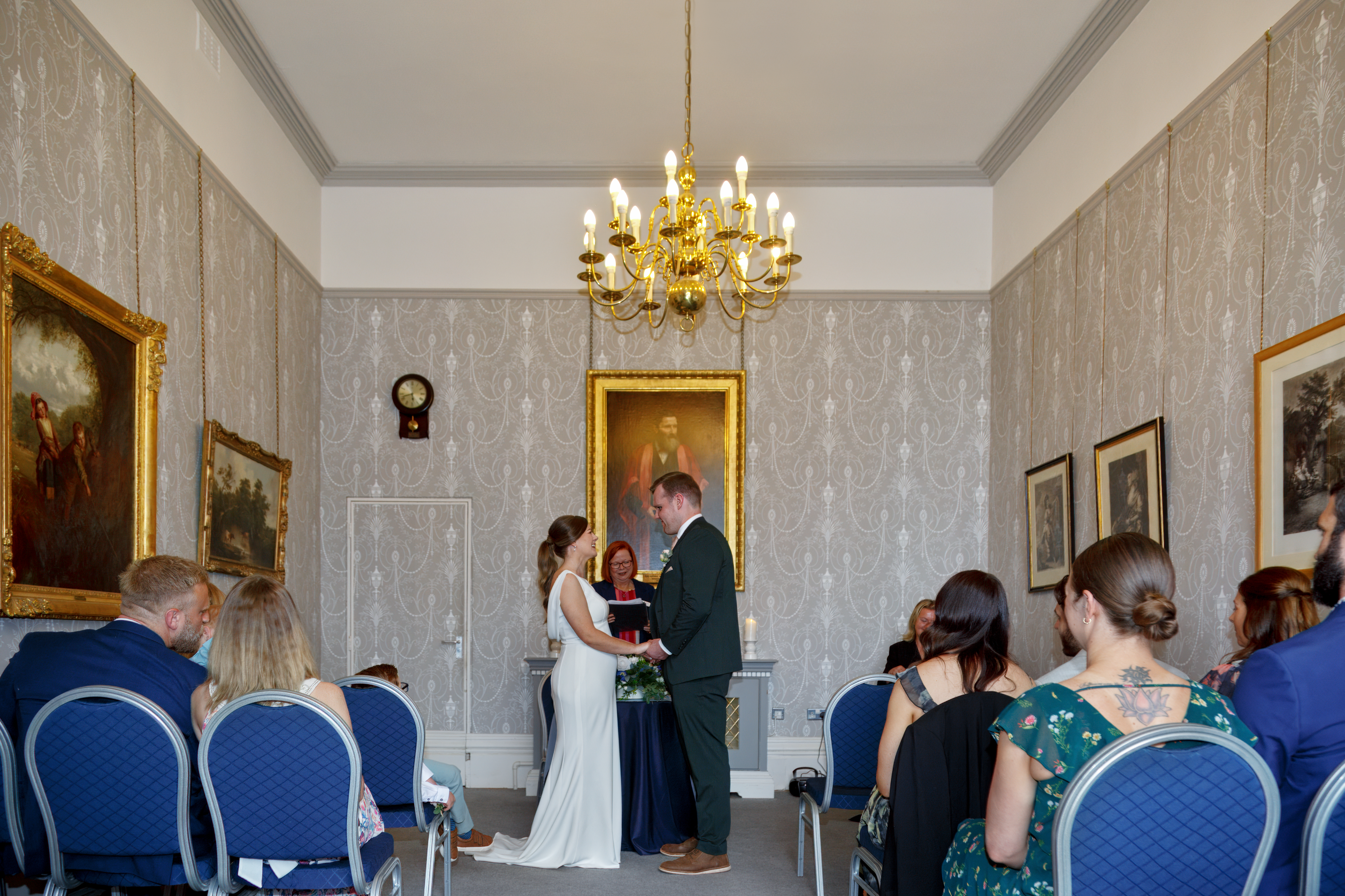 Couple holding hands during their wedding ceremony at the Mayor's Parlour Sudbury Town Hall