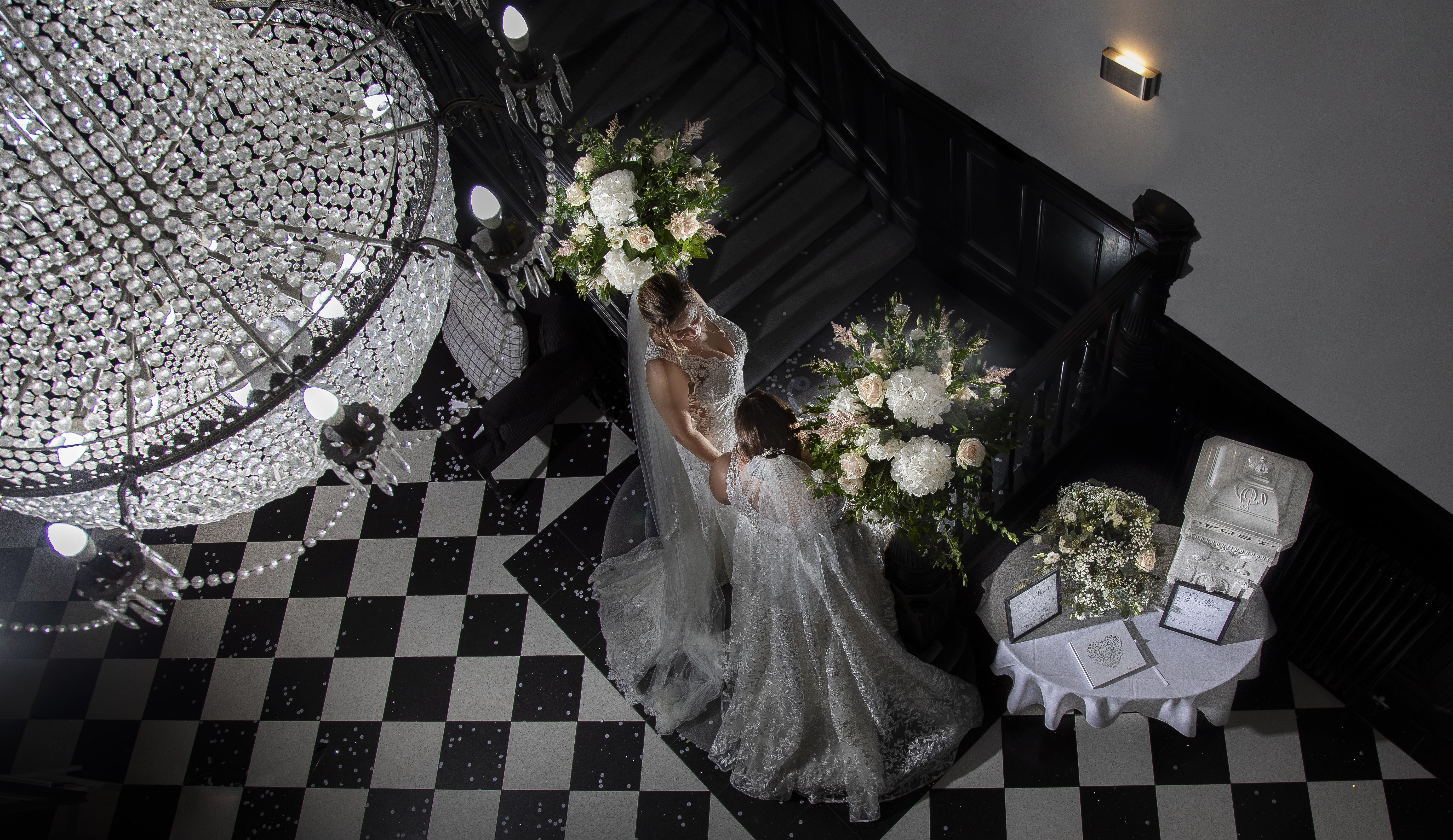 Two brides holding hands. Birdseye view. 