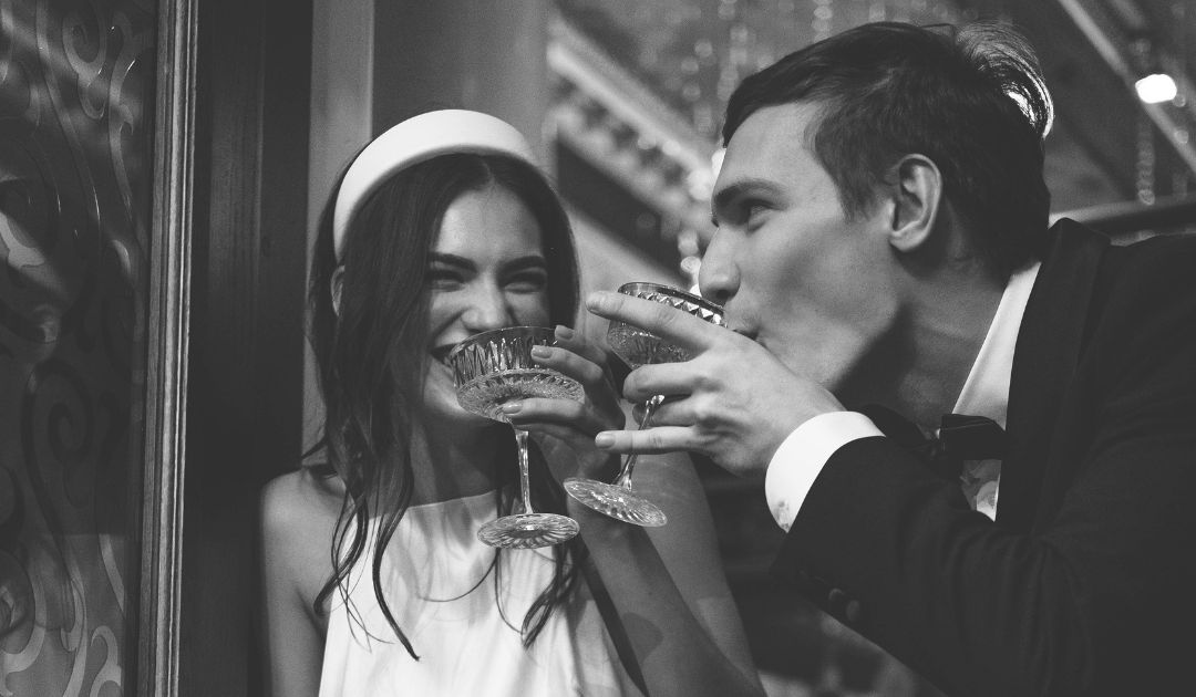 Bride and groom enjoying cocktail