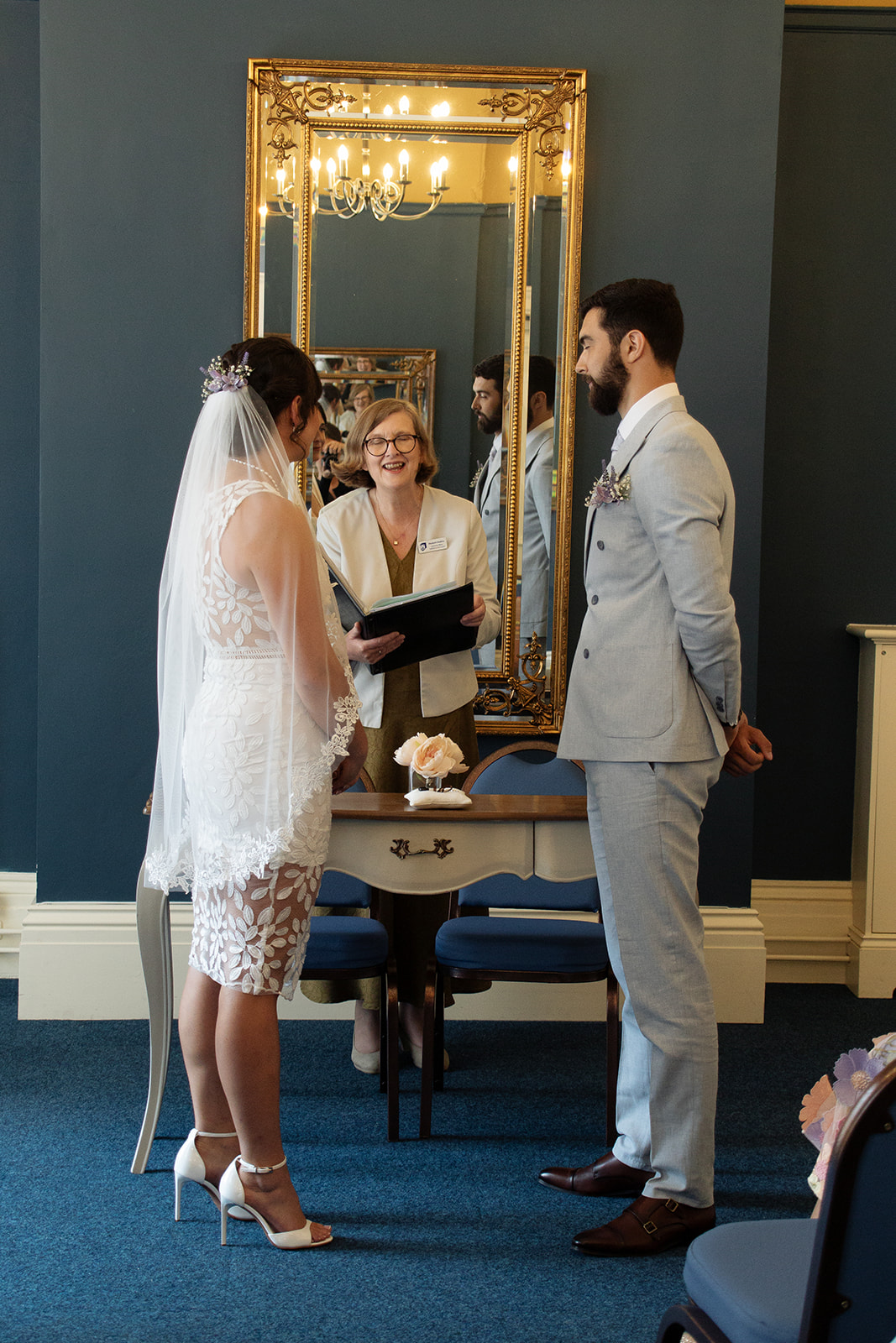 Wedding ceremony at the Pickwick Room at Ipswich Town Hall. Bride and Groom with Suffolk Registrars Celebrant 