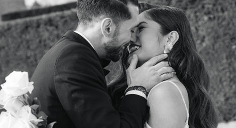 Couple kissing in black and white photo