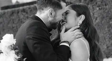 Couple kissing in black and white photo