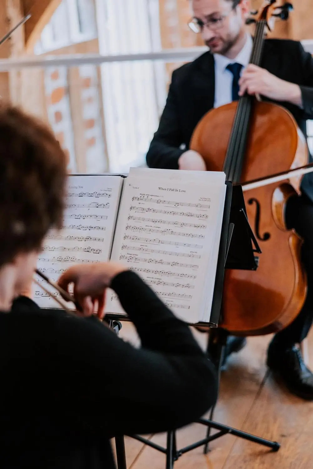 Scintillo String Quartet cellist and sheet music