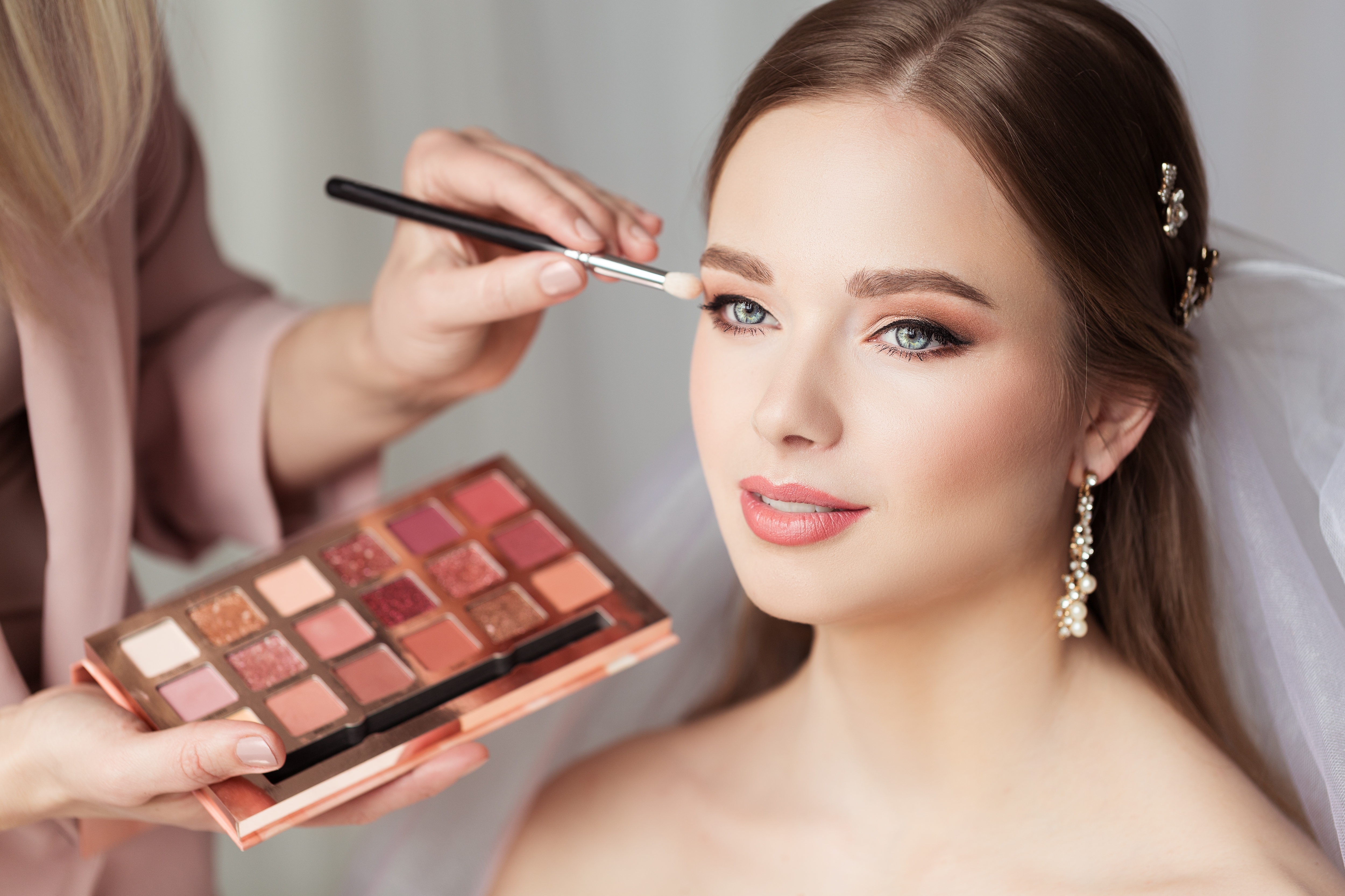 Young bride having her wedding make up done.